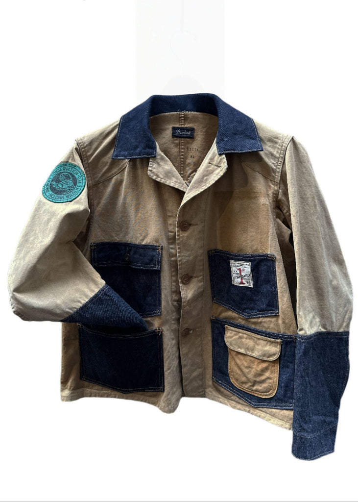 Introducing the 1st Standard Brooklyn Rework Hunting Jacket, a distinctive fusion of classic hunting jacket aesthetics and modern urban flair, available exclusively at Brooklyn Denim Co. This meticulously crafted jacket exemplifies First Standard Co.'s dedication to enduring craftsmanship and innovative design.  