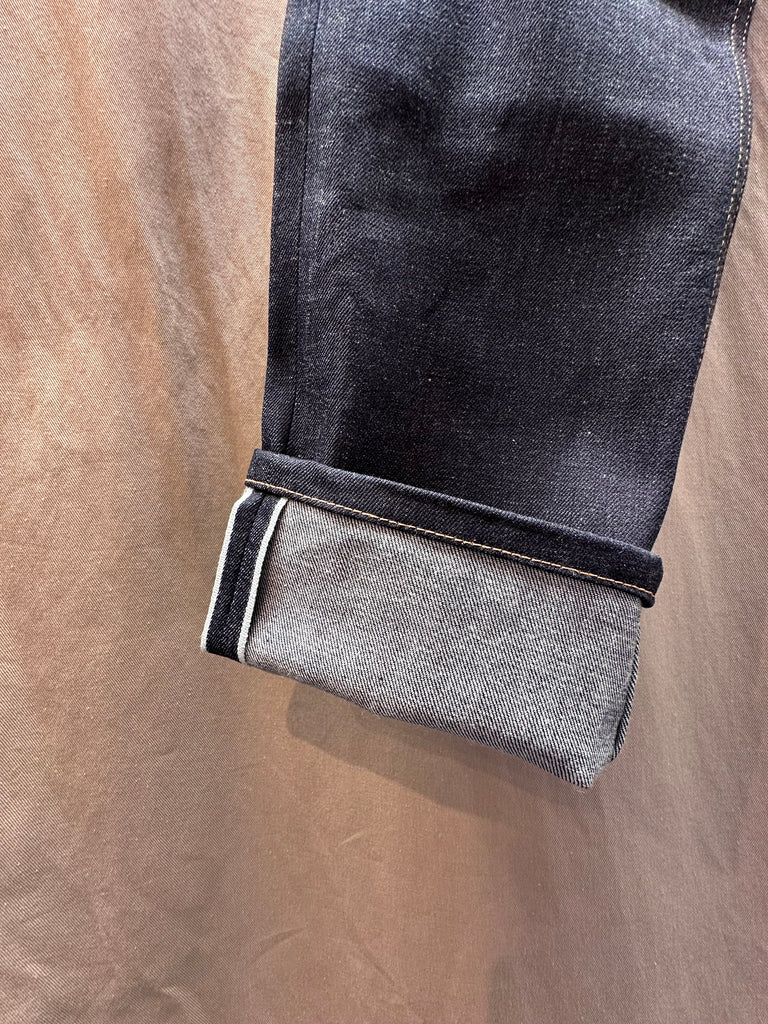 Brooklyn Denim Co Men's Slim 11 oz. Raw Stretch Jean merges modern fit with heritage craftsmanship, delivering a streamlined silhouette that doesn't sacrifice comfort. Cut from premium 11 oz. raw stretch denim fabric, this pair offers the perfect balance of structure and flexibility—ideal for those seeking versatile mens stretch jeans that move with you. Designed in Brooklyn and constructed with meticulous attention to detail, these stretch jeans are built to break in beautifully. 