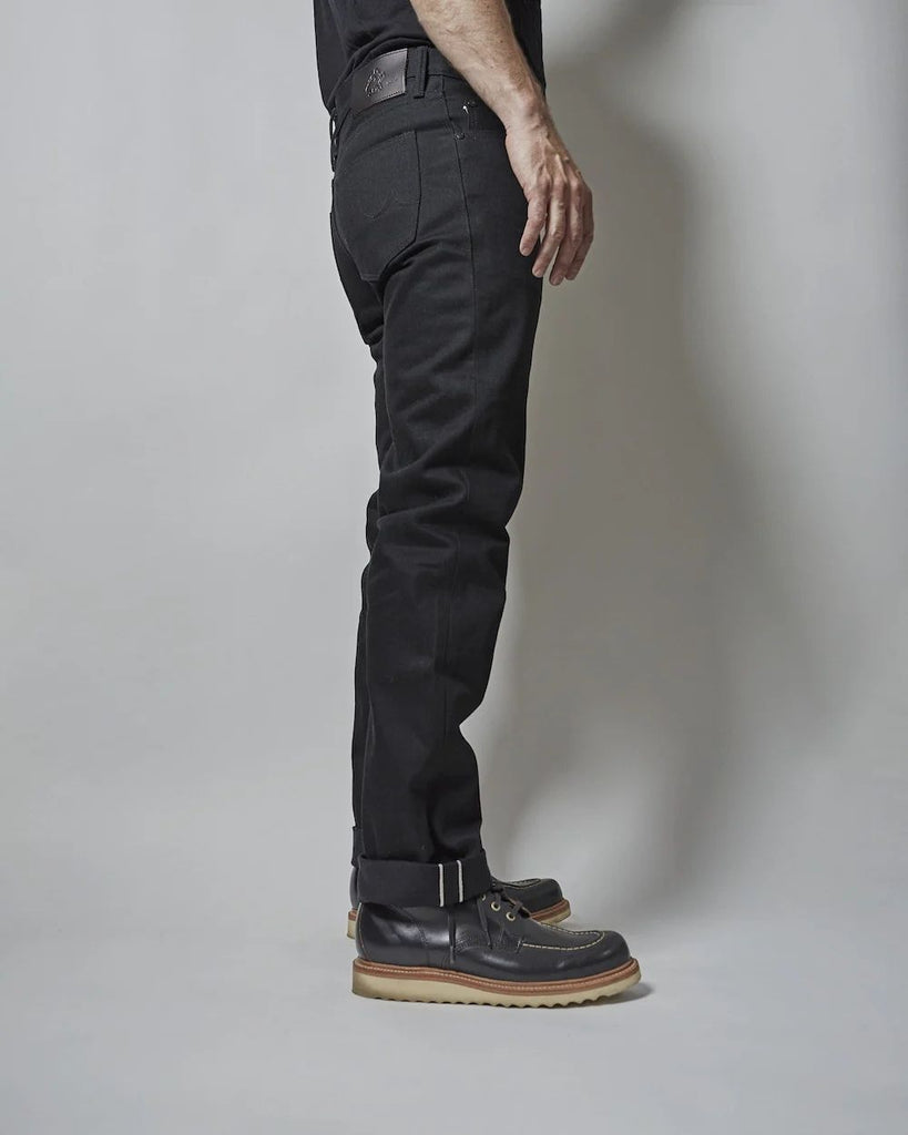 Dark Matter is a medium weight, double black denim with slight slub and a soft hand. It features pure brass "BKLYN" rivets that have been overdyed in black and will create a beautiful shine after months of wear, and black Brooklyn Bridge arcuates on the rear pockets. In the universe dark matter can't be seen, only detected. Let these jeans in your orbit and see who else can't escape their gravitational effects.
- 14oz selvedge denim
- 100% cotton
-Black warp x black weft