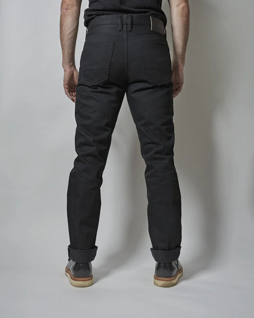 Dark Matter is a medium weight, double black denim with slight slub and a soft hand. It features pure brass "BKLYN" rivets that have been overdyed in black and will create a beautiful shine after months of wear, and black Brooklyn Bridge arcuates on the rear pockets. In the universe dark matter can't be seen, only detected. Let these jeans in your orbit and see who else can't escape their gravitational effects.
- 14oz selvedge denim
- 100% cotton
-Black warp x black weft