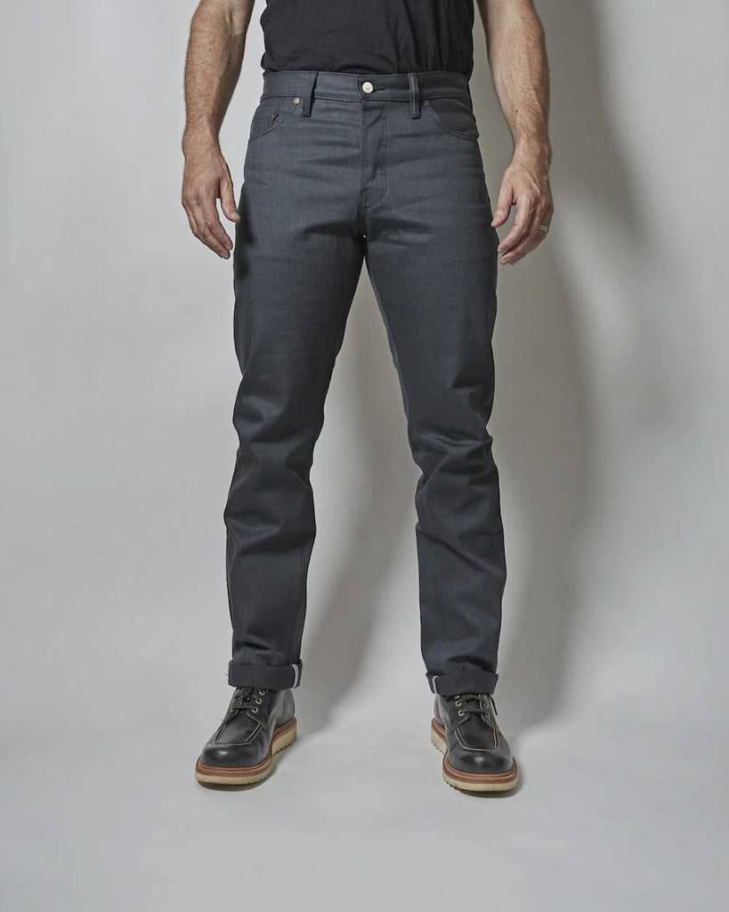 Gunmetal comes in a solid 14oz fabric with slight slub and is made with a charcoal warp and black weft that gives the fabric its distinct dark grey face. It will fade and lighten with wear, though the black fill yarns help to keep the color darker longer. Grey denim is particularly versatile and is often a great way to add a staple and diversify your wardrobe at the same time. A pair of Gunmetal denim slots into any denim lover's well curated closet.
- 14oz selvedge denim
- 100% cotton
-Dark grey warp