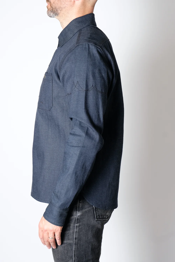 The Fitted Underground Chelsea Selvedge Workshirt is built to endure, combining rugged durability with refined, heritage craftsmanship. Crafted in Brooklyn from heavyweight 11 oz. Japanese selvedge denim fabric, this workshirt offers a perfect balance of structure, comfort, and breathability—making it an essential layering piece for cooler days or a sleek, standalone shirt for year-round wear.