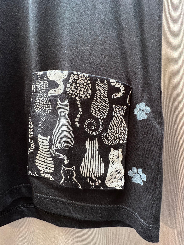 The NY Denim Academy Cat Pocket Tee brings playful charm and effortless versatility to your everyday wardrobe, designed for those who appreciate casual style with a creative edge. Crafted from ultra-soft cotton, this tee features a relaxed fit and a bold cat graphic on the chest pocket—adding a touch of personality to any look.

Perfect on its own or layered under your favorite blazer and jeans, this tee is designed to elevate your casual outfits while keeping comfort front and center. 