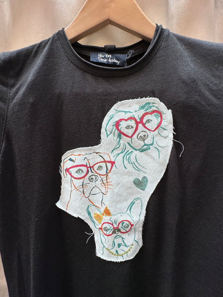 The NY Denim Academy Patch Dog Tee fuses streetwear cool with playful charm, offering a standout essential for casual, creative dressing. Crafted from premium soft cotton, this relaxed-fit tee features a unique embroidered dog patch on the chest—adding a bold touch of personality that channels downtown NYC attitude.

Designed for versatile styling, this tee wears effortlessly with your favorite denim or layered under a blazer and jeans for a polished, off-duty look. 