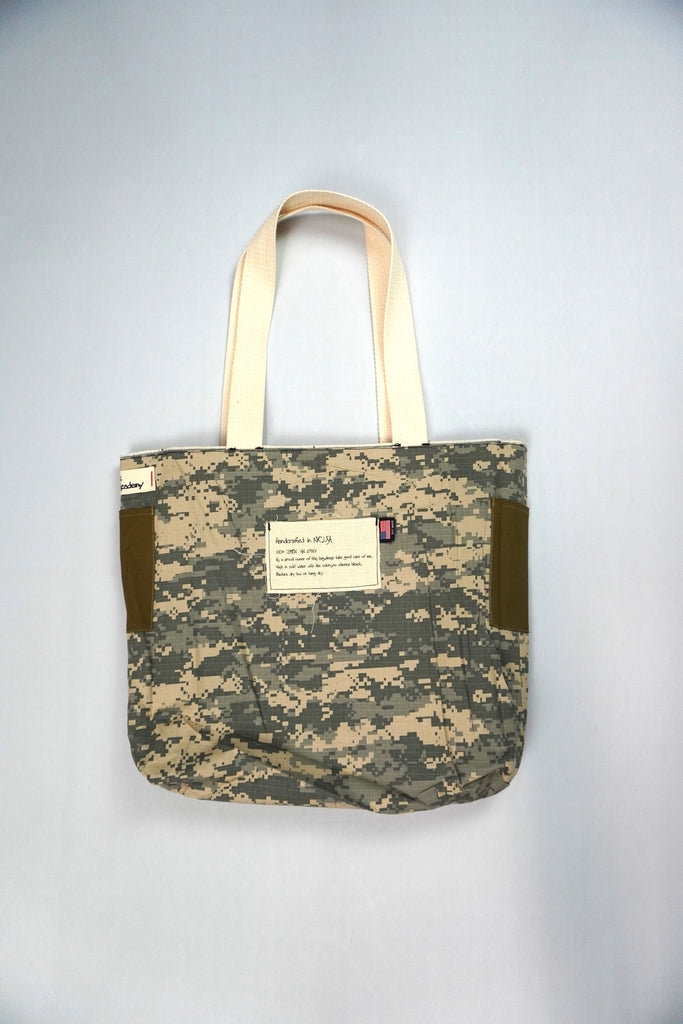 Introducing the NY Denim Academy Selvedge Zip Tote with Camo, a premium accessory that seamlessly blends style, durability, and functionality. This tote bag is designed to cater to the needs of modern individuals who value both fashion and practicality.

Key Features:

High-Quality Selvedge Denim: Crafted from premium selvedge denim, this tote offers exceptional durability and a timeless aesthetic, ensuring it withstands daily use while maintaining its classic appeal.