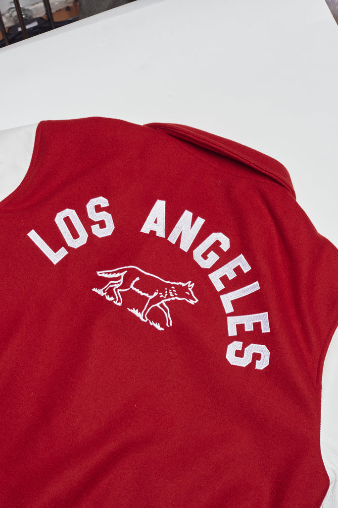 Signature letterman jacket
Made in Los Angeles
Bodice fabric: 75% wool, 25% nylon | Made in USA
Sleeves: 100% leather | Made in Italy
Ribbing: 50% acrylic, 50% polyester| Made in USA
Lining: 100% polyester-satin | Made in Japan
Patches: Made in USA
Snap Buttons: Made in USA
Dry clean only