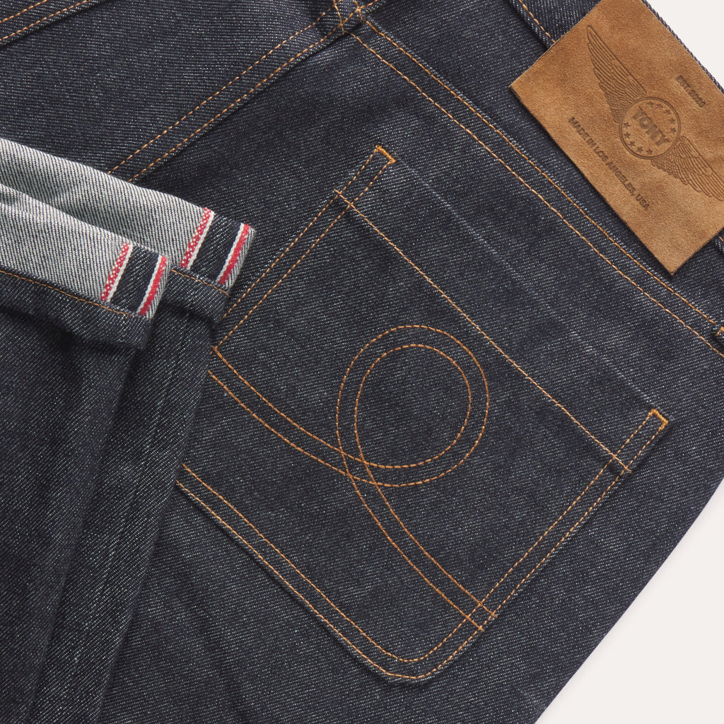 Five pocket raw denim jeans
Made in Los Angeles
Real leather debossed patch
Signature loop embroidered back patch pockets
Silver tack button closure on waistband
Fabric: 100% organic cotton | Grown and Woven in USA
Buttons and rivets: Made in Italy
Pocket lining: 100% cotton | Made in USA
Zipper: YKK | Made in USA
Patch: 100% leather | Made in Italy
