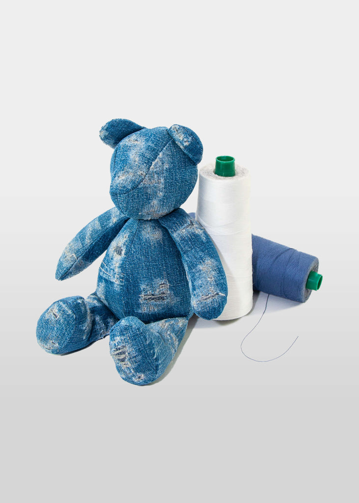 

This stuffed toy by Big Blue Z &amp; Co. is a artisanal Teddy Bear Made in New York City. After exploring different ways to introduce eco-sustainable products, Big Z Co. created these one of a kind bears that bring new life to fabric scraps.

Each bear is unique, made from up-cycled vintage denim and indigo dyed cotton materials.


100% cotton
Indigo dyed
Made in New York City
Bear Height: 11"
Across Open Arms: 10"
