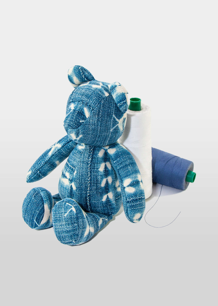 This stuffed toy by Big Blue Z Co. is a artisanal Teddy Bear Made in New York City. After exploring different ways to introduce eco-sustainable products, Big Z &amp; Co. created these one of a kind bears that bring new life to fabric scraps.

Each bear is unique, made from up-cycled vintage denim and indigo dyed cotton materials.


100% cotton
Indigo dyed
Made in New York City
Bear Height:11"