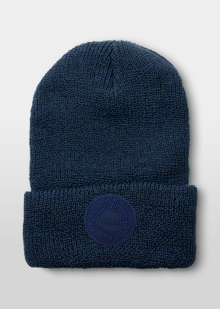 Introducing the Brooklyn Denim Co. Embroidered Seal Beanie in Navy, a premium accessory that combines warmth, style, and quality craftsmanship.

Key Features:

    100% Wool Construction: Expertly crafted from high-quality wool, this beanie offers superior warmth and comfort, making it an ideal choice for cooler weather.

    Embroidered Seal Design: Featuring Brooklyn Denim Co.'s signature embroidered seal, this beanie adds a touch of distinctive style to your ensemble.