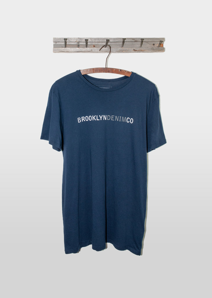 The Brooklyn Denim Co. Organic Cotton Logo Tee is a testament to quality and simplicity, offering a super soft, short sleeve crew neck design that seamlessly integrates into any wardrobe. Crafted from 100% organic cotton, this pre-shrunk, tagless tee ensures maximum comfort and durability. Proudly made in the USA, it features the distinctive Brooklyn Denim Co. logo, making it a staple for those who appreciate sustainable fashion and timeless design.
100% Organic Cotton