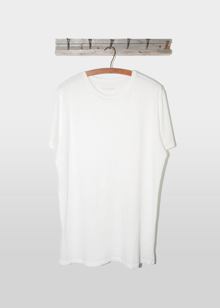 Brooklyn Denim Co. Organic Cotton Tee  - White. This Brooklyn Denim Co. super soft short sleeve tee features a crew neckline.

Details:

*100% organic cotton

*Pre-Shrunk

*No tag

*Made in USA