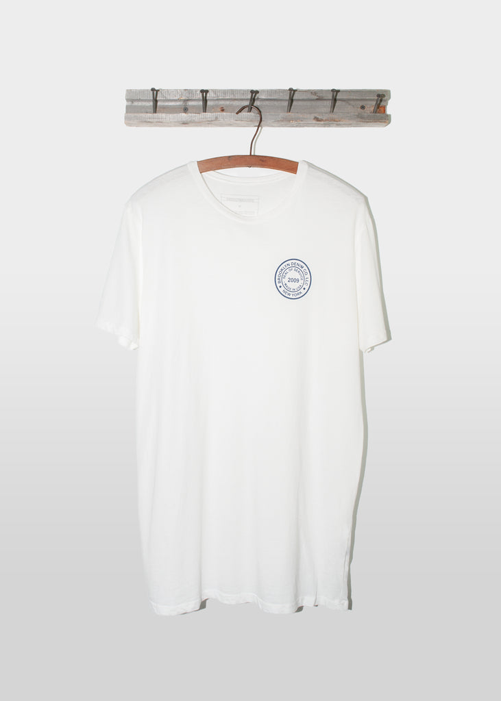 Brooklyn Denim Co. Graphic Tee. This Brooklyn Denim Co. screen printed logo seal tee is a super soft short sleeve tee with a crew neckline.

Details:

*100% organic cotton

*Pre-Shrunk

*No tag

*Made in USA