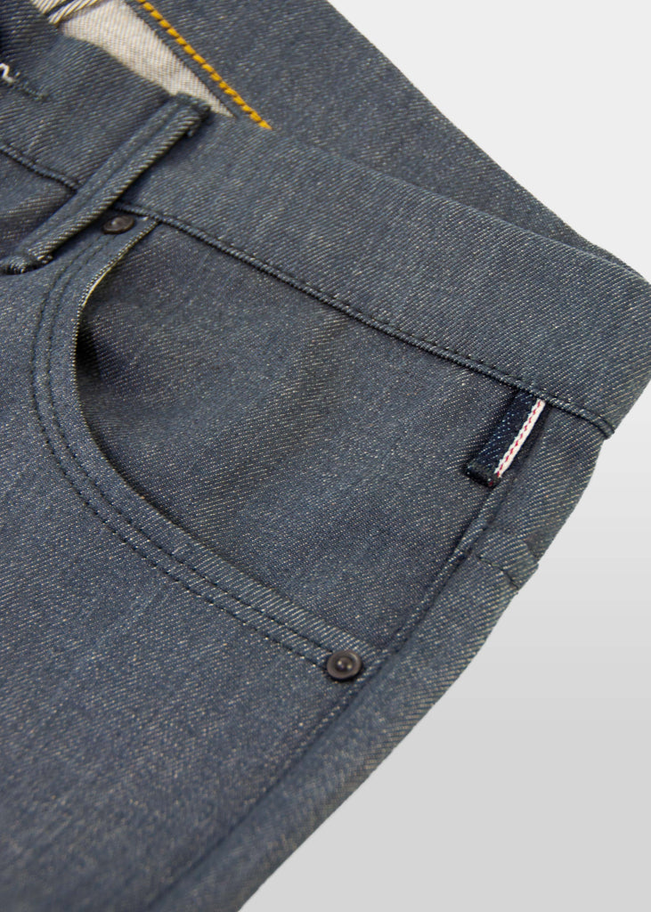 This is the grey version of Matias' proprietary RUNN fabric from Candiani Mills in Milan!

Hence, this sleek, flat fabric is only available to us!

Runs 2 sizes larger than normal.

Fit : mid rise, slim taper. Not skinny.
Fabric : 11oz Grey sulfur dyed warp with a natural weft Candiani 98% cotton ; 2% elastane NON SELVAGE
Finish : resin coated 