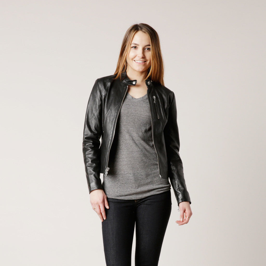 This Schott NYC 141W lightweight women's jacket features soft lambskin leather with a zip up front, floral printed lining and three front pockets.

Details:

*Lambskin Leather

*Printed polyester lining

*22" Length

*"Cafe" zip front jacket

*Imported

Schott NYC jackets have become a symbol of American culture, growing and changing as America does, defining everything they do and every jacket they make. From the creation of the PERFECTO motorcycle jacket, made famous on the backs of Brando &  Dean. 